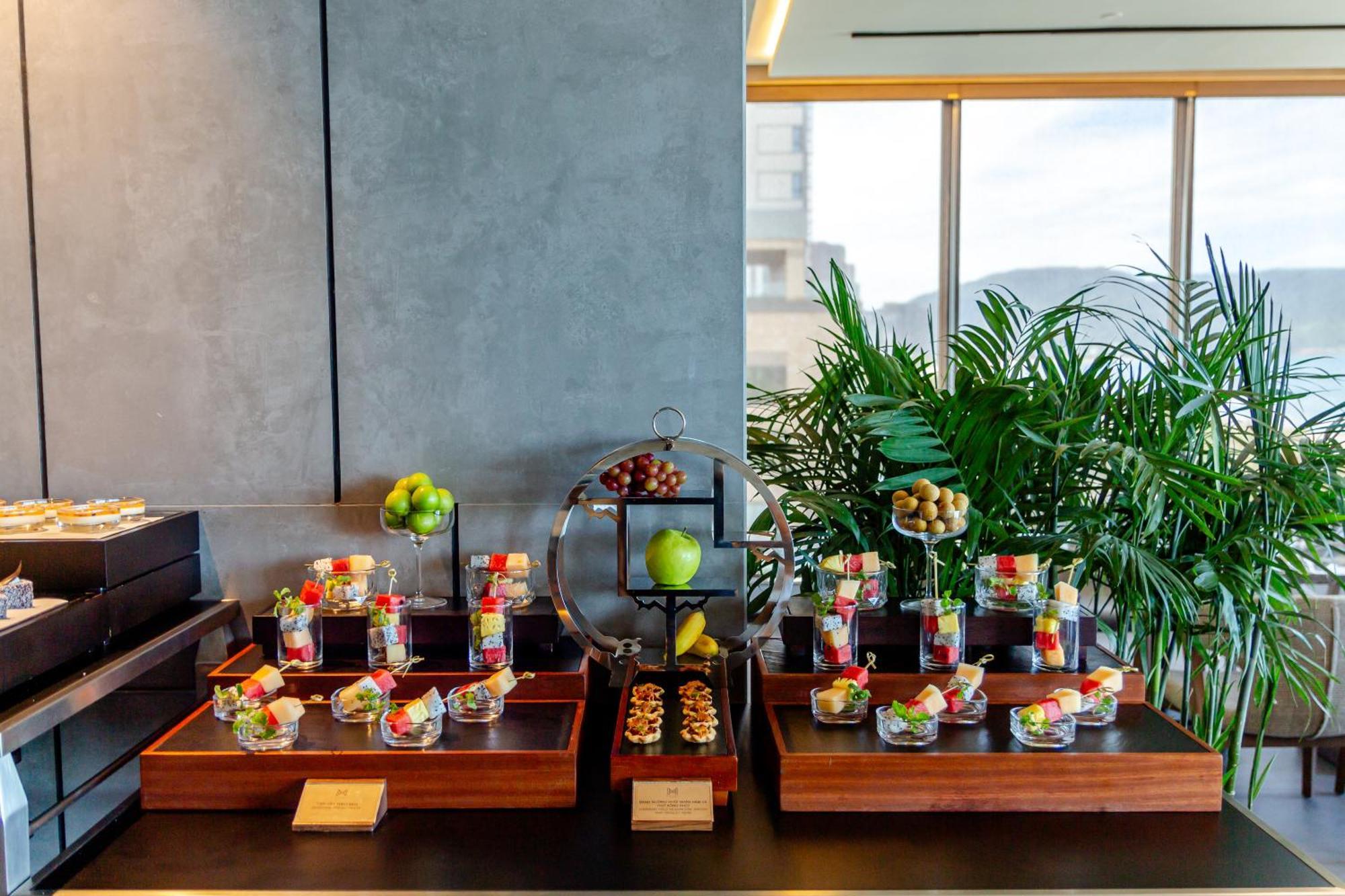M Hotel Danang Екстериор снимка A selection of desserts at the lounge